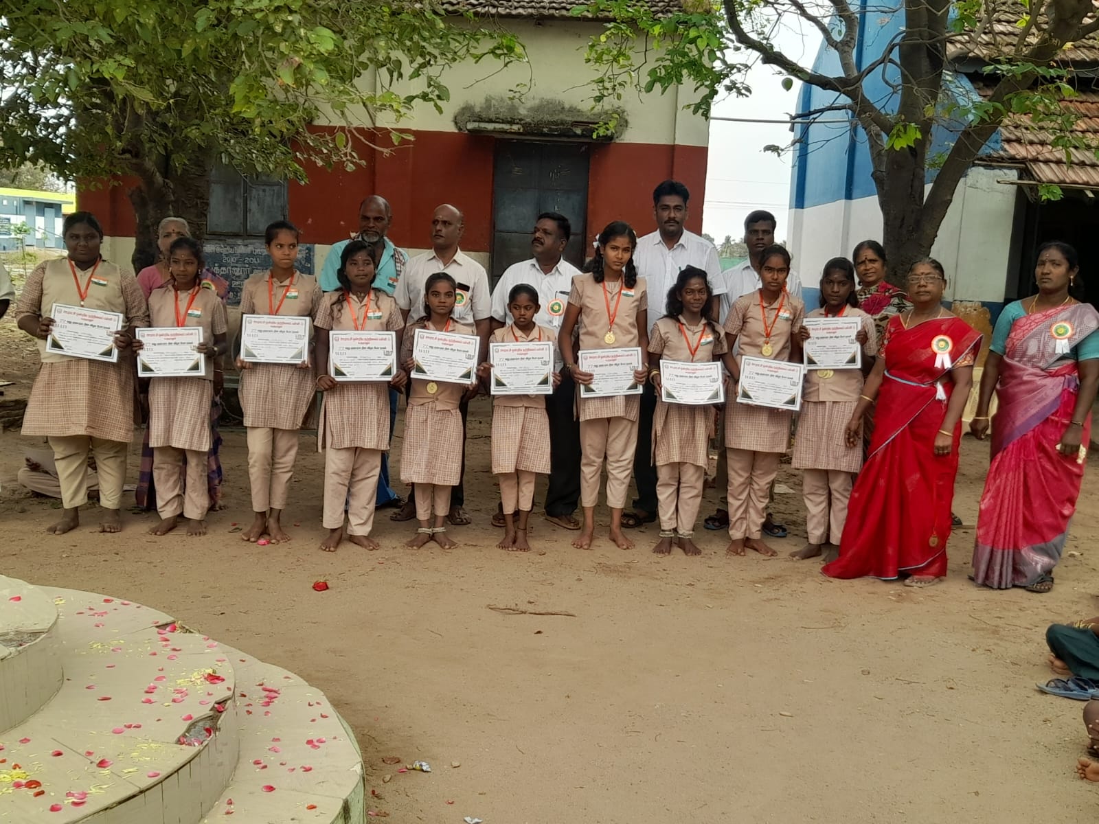 Students receiving school supplies and scholarships